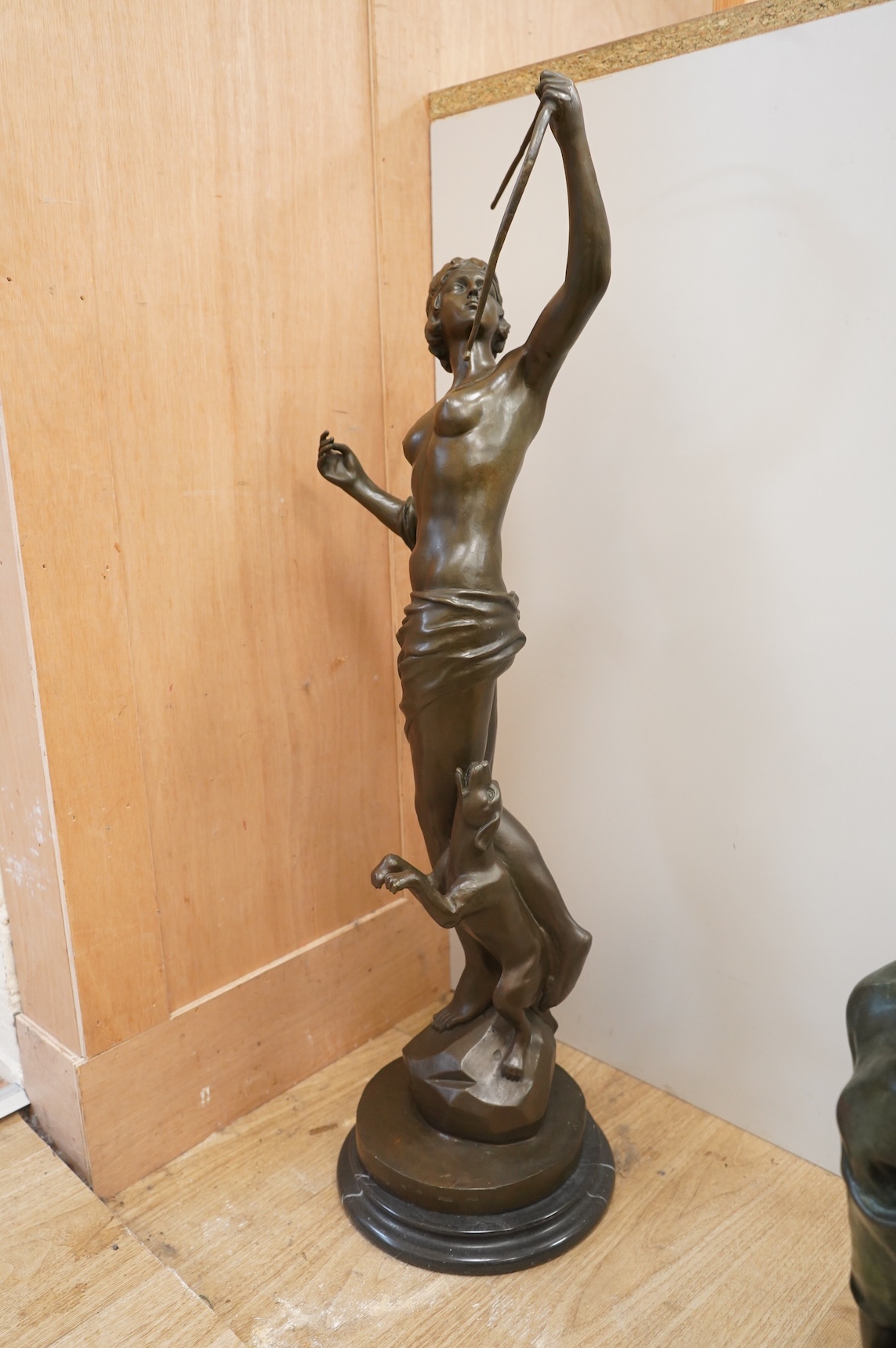 A large Art Deco style patinated bronze figure of Diana, unsigned on black marble base, height 85cm
